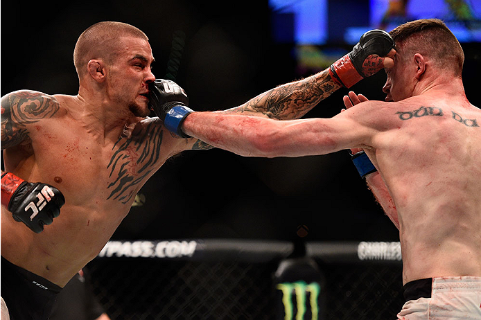 LAS VEGAS, NV - JANUARY 02: (L-R) Dustin Poirier and Joe Duffy of Ireland exchange punches in their lightweight bout during the UFC 195 event inside MGM Grand Garden Arena on January 2, 2016 in Las Vegas, Nevada. (Photo by Jeff Bottari/Zuffa LLC/Zuffa LL
