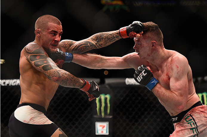 LAS VEGAS, NV - JANUARY 02: (R-L) Joe Duffy of Ireland punches Dustin Poirier in their lightweight bout during the UFC 195 event inside MGM Grand Garden Arena on January 2, 2016 in Las Vegas, Nevada. (Photo by Jeff Bottari/Zuffa LLC/Zuffa LLC via Getty I