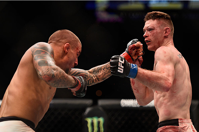 LAS VEGAS, NV - JANUARY 02: (L-R) Dustin Poirier punches Joe Duffy of Ireland in their lightweight bout during the UFC 195 event inside MGM Grand Garden Arena on January 2, 2016 in Las Vegas, Nevada. (Photo by Jeff Bottari/Zuffa LLC/Zuffa LLC via Getty I