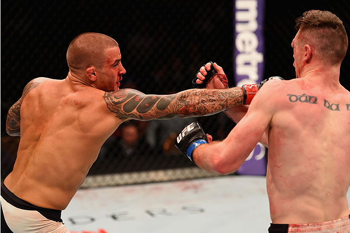 LAS VEGAS, NV - JANUARY 02: (L-R) Dustin Poirier punches Joe Duffy of Ireland in their lightweight bout during the UFC 195 event inside MGM Grand Garden Arena on January 2, 2016 in Las Vegas, Nevada. (Photo by Josh Hedges/Zuffa LLC/Zuffa LLC via Getty Im
