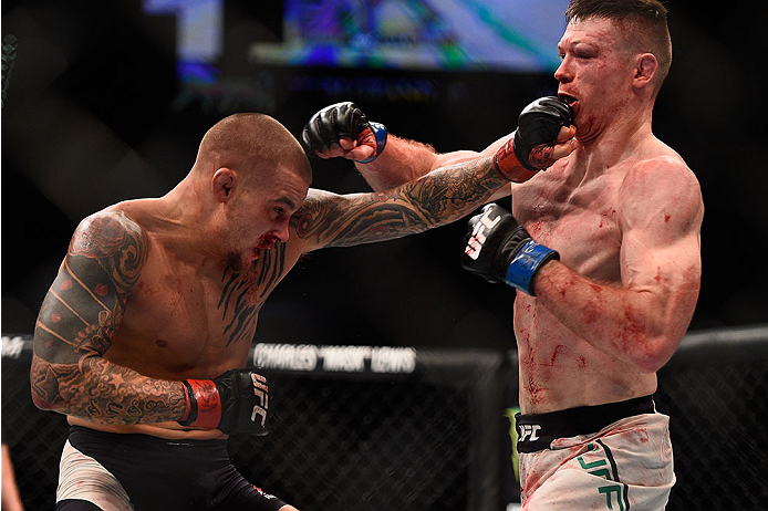 LAS VEGAS, NV - JANUARY 02: (L-R) Dustin Poirier punches Joe Duffy of Ireland in their lightweight bout during the UFC 195 event inside MGM Grand Garden Arena on January 2, 2016 in Las Vegas, Nevada. (Photo by Jeff Bottari/Zuffa LLC/Zuffa LLC via Getty I