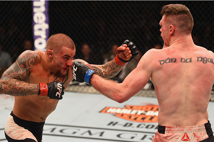 LAS VEGAS, NV - JANUARY 02: (R-L) Joe Duffy of Ireland punches Dustin Poirier in their lightweight bout during the UFC 195 event inside MGM Grand Garden Arena on January 2, 2016 in Las Vegas, Nevada. (Photo by Josh Hedges/Zuffa LLC/Zuffa LLC via Getty Im