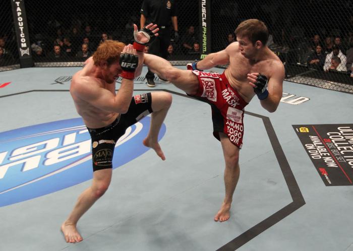 TORONTO, ON - DECEMBER 10: (R-L) Nik Lentz kicks Mark Bocek during the UFC 140 event at Air Canada Centre on December 10, 2011 in Toronto, Ontario, Canada. (Photo by Nick Laham/Zuffa LLC/Zuffa LLC via Getty Images)