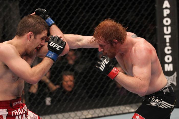 TORONTO, ON - DECEMBER 10: (R-L) Mark Bocek punches Nik Lentz during the UFC 140 event at Air Canada Centre on December 10, 2011 in Toronto, Ontario, Canada. (Photo by Nick Laham/Zuffa LLC/Zuffa LLC via Getty Images)