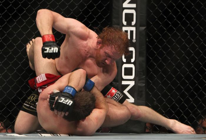 TORONTO, ON - DECEMBER 10: Mark Bocek punches down at Nik Lentz on the ground during the UFC 140 event at Air Canada Centre on December 10, 2011 in Toronto, Ontario, Canada. (Photo by Josh Hedges/Zuffa LLC/Zuffa LLC via Getty Images)
