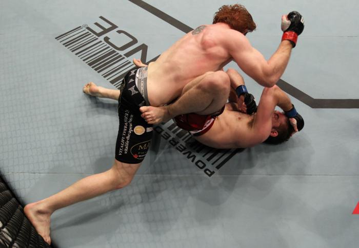 TORONTO, ON - DECEMBER 10: (L-R) Mark Bocek punches Nik Lentz during the UFC 140 event at Air Canada Centre on December 10, 2011 in Toronto, Ontario, Canada. (Photo by Nick Laham/Zuffa LLC/Zuffa LLC via Getty Images)