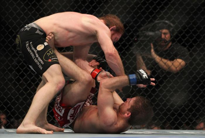TORONTO, ON - DECEMBER 10: Mark Bocek punches down at Nik Lentz on the ground during the UFC 140 event at Air Canada Centre on December 10, 2011 in Toronto, Ontario, Canada. (Photo by Josh Hedges/Zuffa LLC/Zuffa LLC via Getty Images)
