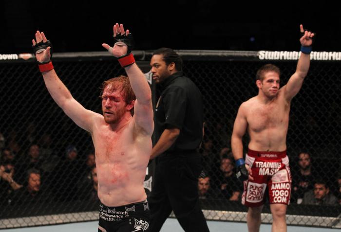 TORONTO, ON - DECEMBER 10: Mark Bocek (L) and Nik Lentz (R) react after their three-round battle during the UFC 140 event at Air Canada Centre on December 10, 2011 in Toronto, Ontario, Canada. (Photo by Nick Laham/Zuffa LLC/Zuffa LLC via Getty Images)