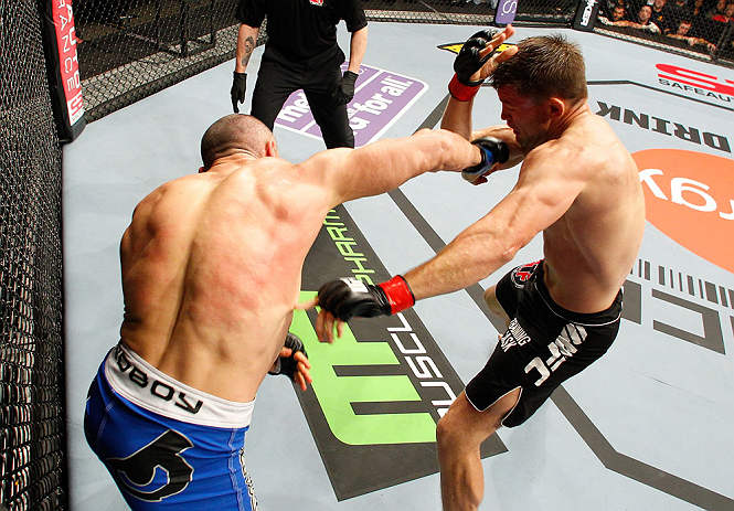 LONDON, ENGLAND - FEBRUARY 16: (L-R) Stanislav Nedkov punches Tom Watson in their middleweight fight during the UFC on Fuel TV event on February 16, 2013 at Wembley Arena in London, England. (Photo by Josh Hedges/Zuffa LLC/Zuffa LLC via Getty Images)