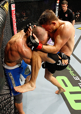 LONDON, ENGLAND - FEBRUARY 16: (R-L) Tom Watson knees Stanislav Nedkov in their middleweight fight during the UFC on Fuel TV event on February 16, 2013 at Wembley Arena in London, England. (Photo by Josh Hedges/Zuffa LLC/Zuffa LLC via Getty Images)