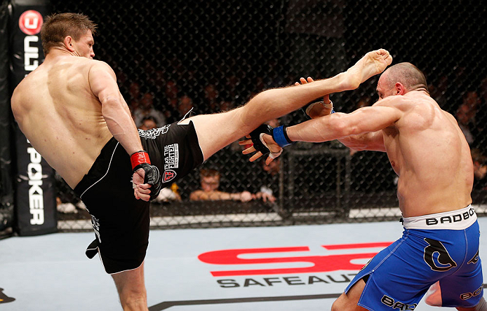 LONDON, ENGLAND - FEBRUARY 16: (L-R) Tom Watson kicks Stanislav Nedkov in their middleweight fight during the UFC on Fuel TV event on February 16, 2013 at Wembley Arena in London, England. (Photo by Josh Hedges/Zuffa LLC/Zuffa LLC via Getty Images)