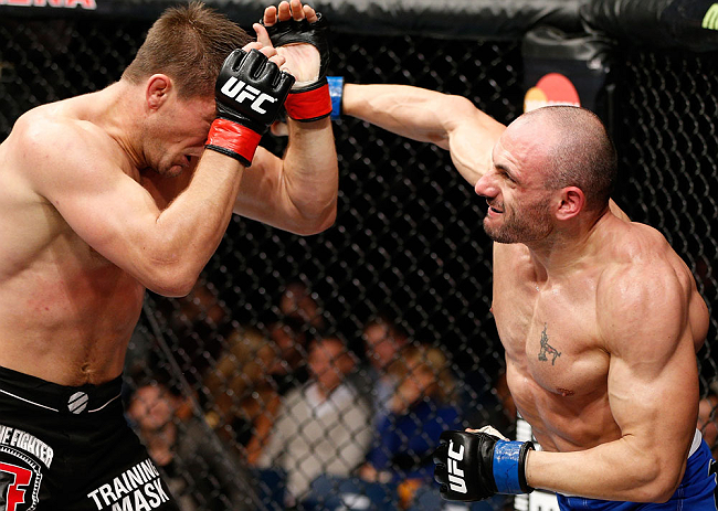 LONDON, ENGLAND - FEBRUARY 16: (R-L) Stanislav Nedkov punches Tom Watson in their middleweight fight during the UFC on Fuel TV event on February 16, 2013 at Wembley Arena in London, England. (Photo by Josh Hedges/Zuffa LLC/Zuffa LLC via Getty Images)