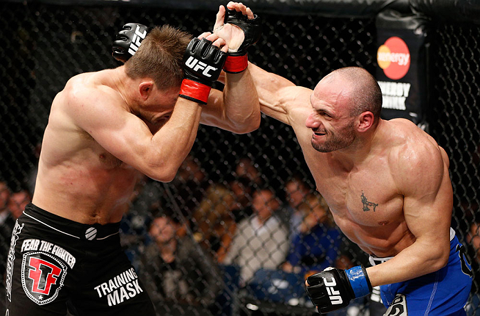 LONDON, ENGLAND - FEBRUARY 16: (R-L) Stanislav Nedkov punches Tom Watson in their middleweight fight during the UFC on Fuel TV event on February 16, 2013 at Wembley Arena in London, England. (Photo by Josh Hedges/Zuffa LLC/Zuffa LLC via Getty Images)