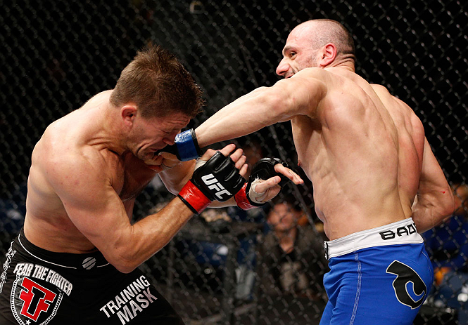 LONDON, ENGLAND - FEBRUARY 16: (R-L) Stanislav Nedkov punches Tom Watson in their middleweight fight during the UFC on Fuel TV event on February 16, 2013 at Wembley Arena in London, England. (Photo by Josh Hedges/Zuffa LLC/Zuffa LLC via Getty Images)
