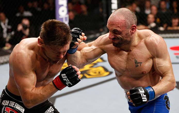 LONDON, ENGLAND - FEBRUARY 16: (R-L) Stanislav Nedkov punches Tom Watson in their middleweight fight during the UFC on Fuel TV event on February 16, 2013 at Wembley Arena in London, England. (Photo by Josh Hedges/Zuffa LLC/Zuffa LLC via Getty Images)