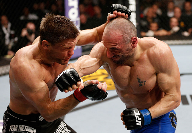 LONDON, ENGLAND - FEBRUARY 16: (R-L) Stanislav Nedkov punches Tom Watson in their middleweight fight during the UFC on Fuel TV event on February 16, 2013 at Wembley Arena in London, England. (Photo by Josh Hedges/Zuffa LLC/Zuffa LLC via Getty Images)