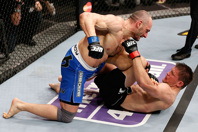 LONDON, ENGLAND - FEBRUARY 16: (L-R) Stanislav Nedkov punches Tom Watson in their middleweight fight during the UFC on Fuel TV event on February 16, 2013 at Wembley Arena in London, England. (Photo by Josh Hedges/Zuffa LLC/Zuffa LLC via Getty Images)