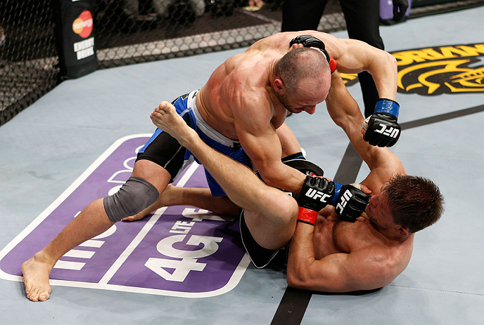 LONDON, ENGLAND - FEBRUARY 16: (L-R) Stanislav Nedkov punches Tom Watson in their middleweight fight during the UFC on Fuel TV event on February 16, 2013 at Wembley Arena in London, England. (Photo by Josh Hedges/Zuffa LLC/Zuffa LLC via Getty Images)
