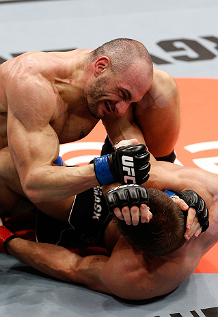 LONDON, ENGLAND - FEBRUARY 16: (L-R) Stanislav Nedkov punches Tom Watson in their middleweight fight during the UFC on Fuel TV event on February 16, 2013 at Wembley Arena in London, England. (Photo by Josh Hedges/Zuffa LLC/Zuffa LLC via Getty Images)