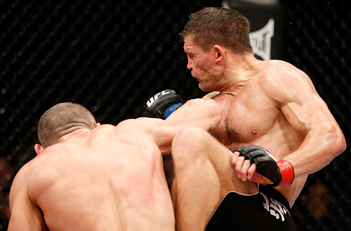 LONDON, ENGLAND - FEBRUARY 16: (L-R) Stanislav Nedkov punches Tom Watson in their middleweight fight during the UFC on Fuel TV event on February 16, 2013 at Wembley Arena in London, England. (Photo by Josh Hedges/Zuffa LLC/Zuffa LLC via Getty Images)