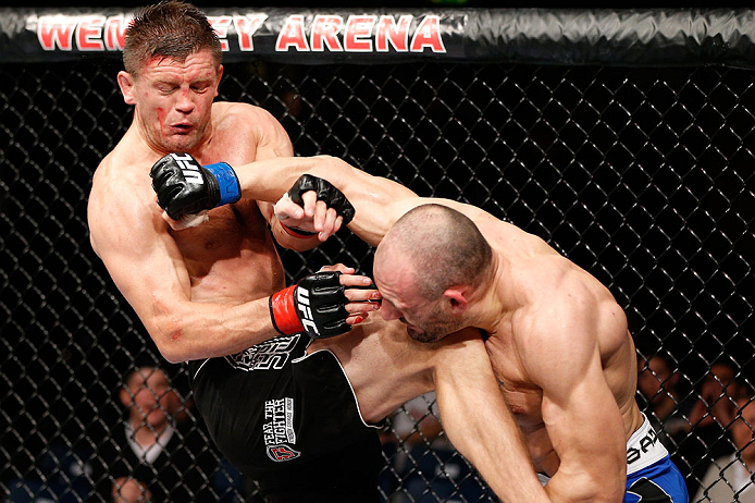 LONDON, ENGLAND - FEBRUARY 16: (R-L) Stanislav Nedkov punches Tom Watson in their middleweight fight during the UFC on Fuel TV event on February 16, 2013 at Wembley Arena in London, England. (Photo by Josh Hedges/Zuffa LLC/Zuffa LLC via Getty Images)