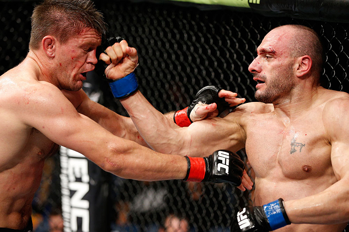LONDON, ENGLAND - FEBRUARY 16: (R-L) Stanislav Nedkov punches Tom Watson in their middleweight fight during the UFC on Fuel TV event on February 16, 2013 at Wembley Arena in London, England. (Photo by Josh Hedges/Zuffa LLC/Zuffa LLC via Getty Images)