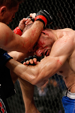 LONDON, ENGLAND - FEBRUARY 16: (L-R) Tom Watson knees Stanislav Nedkov in their middleweight fight during the UFC on Fuel TV event on February 16, 2013 at Wembley Arena in London, England. (Photo by Josh Hedges/Zuffa LLC/Zuffa LLC via Getty Images)