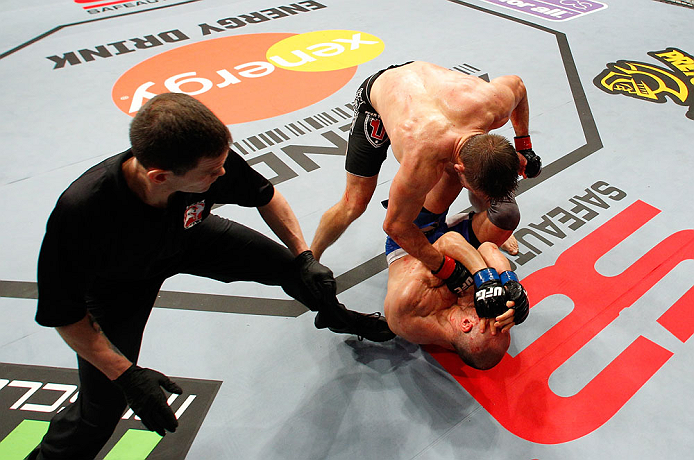 LONDON, ENGLAND - FEBRUARY 16: Tom Watson (top) punches Stanislav Nedkov in their middleweight fight during the UFC on Fuel TV event on February 16, 2013 at Wembley Arena in London, England. (Photo by Josh Hedges/Zuffa LLC/Zuffa LLC via Getty Images)