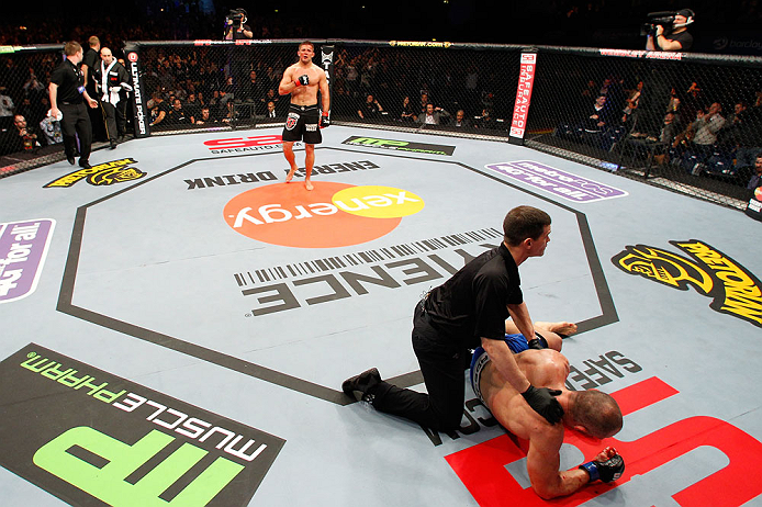 LONDON, ENGLAND - FEBRUARY 16: (L-R) Tom Watson reacts after defeating Stanislav Nedkov in their middleweight fight during the UFC on Fuel TV event on February 16, 2013 at Wembley Arena in London, England. (Photo by Josh Hedges/Zuffa LLC/Zuffa LLC via