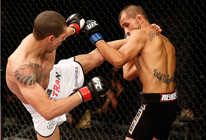 BELO HORIZONTE, BRAZIL - SEPTEMBER 04: (L-R) Lucas Martins kicks Junior Hernandez in their bantamweight fight during the UFC on FOX Sports 1 event at Mineirinho Arena on September 4, 2013 in Belo Horizonte, Brazil. (Photo by Josh Hedges/Zuffa LLC/Zuffa L