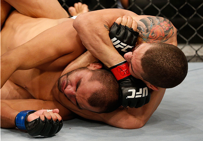 BELO HORIZONTE, BRAZIL - SEPTEMBER 04: (R-L) Lucas Martins secures a rear choke submission against Junior Hernandez in their bantamweight fight during the UFC on FOX Sports 1 event at Mineirinho Arena on September 4, 2013 in Belo Horizonte, Brazil. (Phot