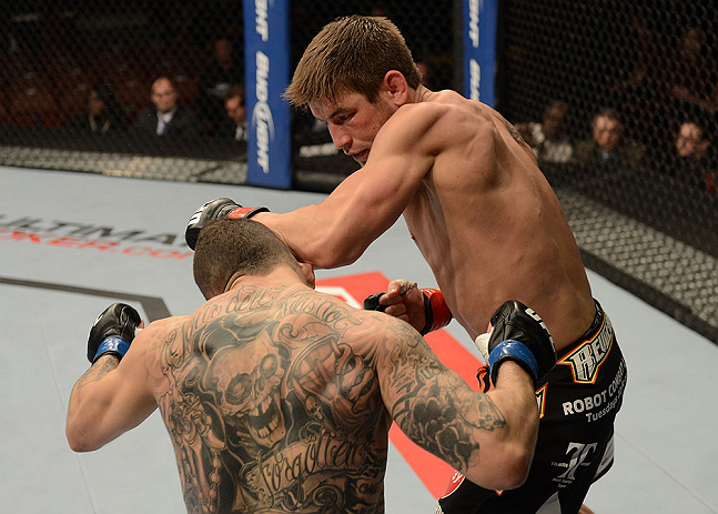 ANAHEIM, CA - FEBRUARY 23: Sam Stout (right) punches Caros Fodor in their lightweight bout during UFC 157 at Honda Center on February 23, 2013 in Anaheim, California. (Photo by Donald Miralle/Zuffa LLC/Zuffa LLC via Getty Images) *** Local Caption *** S