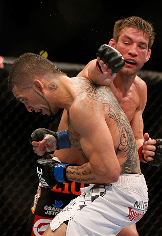 ANAHEIM, CA - FEBRUARY 23: (R-L) Sam Stout punches Caros Fodor in their lightweight bout during UFC 157 at Honda Center on February 23, 2013 in Anaheim, California. (Photo by Josh Hedges/Zuffa LLC/Zuffa LLC via Getty Images) *** Local Caption *** Sam St