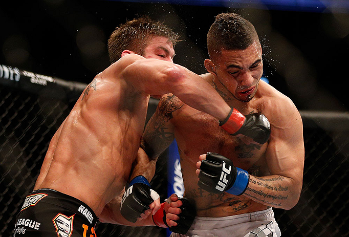 ANAHEIM, CA - FEBRUARY 23: (L-R) Sam Stout punches Caros Fodor in their lightweight bout during UFC 157 at Honda Center on February 23, 2013 in Anaheim, California. (Photo by Josh Hedges/Zuffa LLC/Zuffa LLC via Getty Images) *** Local Caption *** Sam St