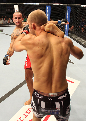 DENVER, CO - AUGUST 11: (L-R) Michael Kuiper kicks Jared Hamman during their middleweight bout at UFC 150 inside Pepsi Center on August 11, 2012 in Denver, Colorado. (Photo by Nick Laham/Zuffa LLC/Zuffa LLC via Getty Images)