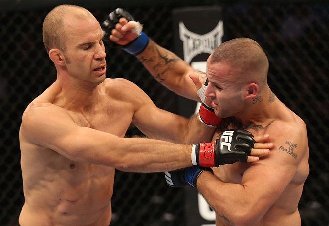 DENVER, CO - AUGUST 11: (R-L) Michael Kuiper punches Jared Hamman during their middleweight bout at UFC 150 inside Pepsi Center on August 11, 2012 in Denver, Colorado. (Photo by Nick Laham/Zuffa LLC/Zuffa LLC via Getty Images)