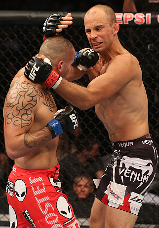DENVER, CO - AUGUST 11: (L-R) Michael Kuiper punches Jared Hamman during their middleweight bout at UFC 150 inside Pepsi Center on August 11, 2012 in Denver, Colorado. (Photo by Nick Laham/Zuffa LLC/Zuffa LLC via Getty Images)