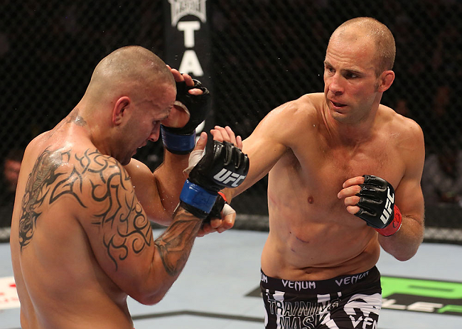 DENVER, CO - AUGUST 11: (R-L) Jared Hamman punches Michael Kuiper during their middleweight bout at UFC 150 inside Pepsi Center on August 11, 2012 in Denver, Colorado. (Photo by Nick Laham/Zuffa LLC/Zuffa LLC via Getty Images)
