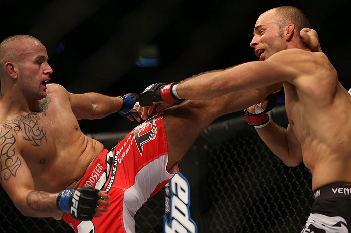 DENVER, CO - AUGUST 11: (L-R) Michael Kuiper kicks Jared Hamman during their middleweight bout at UFC 150 inside Pepsi Center on August 11, 2012 in Denver, Colorado. (Photo by Josh Hedges/Zuffa LLC/Zuffa LLC via Getty Images)