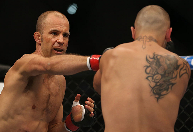 DENVER, CO - AUGUST 11: (L-R) Jared Hamman punches Michael Kuiper during their middleweight bout at UFC 150 inside Pepsi Center on August 11, 2012 in Denver, Colorado. (Photo by Josh Hedges/Zuffa LLC/Zuffa LLC via Getty Images)