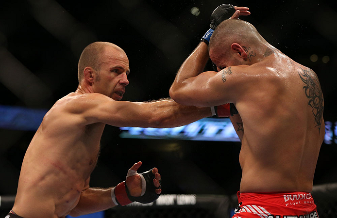 DENVER, CO - AUGUST 11: (L-R) Jared Hamman punches Michael Kuiper during their middleweight bout at UFC 150 inside Pepsi Center on August 11, 2012 in Denver, Colorado. (Photo by Josh Hedges/Zuffa LLC/Zuffa LLC via Getty Images)