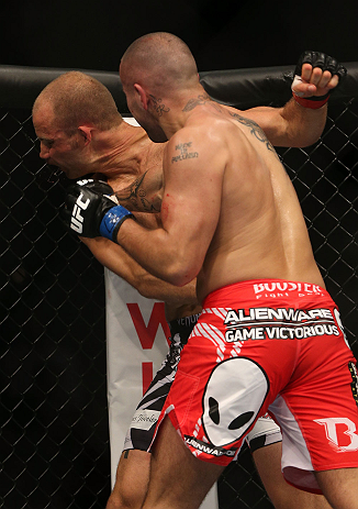 DENVER, CO - AUGUST 11: (R-L) Michael Kuiper punches Jared Hamman during their middleweight bout at UFC 150 inside Pepsi Center on August 11, 2012 in Denver, Colorado. (Photo by Josh Hedges/Zuffa LLC/Zuffa LLC via Getty Images)