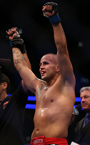 DENVER, CO - AUGUST 11: Michael Kuiper reacts after knocking out Jared Hamman during their middleweight bout at UFC 150 inside Pepsi Center on August 11, 2012 in Denver, Colorado. (Photo by Josh Hedges/Zuffa LLC/Zuffa LLC via Getty Images)