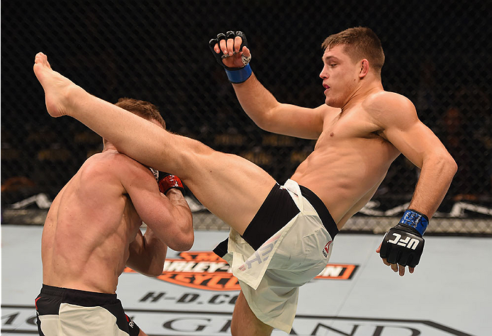 LAS VEGAS, NV - JANUARY 02: (R-L) Drew Dober kicks Scott Holtzman in their lightweight bout during the UFC 195 event inside MGM Grand Garden Arena on January 2, 2016 in Las Vegas, Nevada. (Photo by Josh Hedges/Zuffa LLC/Zuffa LLC via Getty Images)