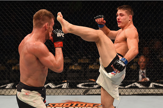 LAS VEGAS, NV - JANUARY 02: (R-L) Drew Dober kicks Scott Holtzman in their lightweight bout during the UFC 195 event inside MGM Grand Garden Arena on January 2, 2016 in Las Vegas, Nevada. (Photo by Josh Hedges/Zuffa LLC/Zuffa LLC via Getty Images)