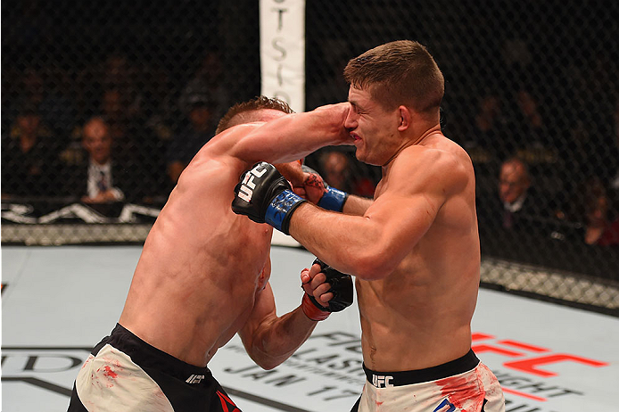 LAS VEGAS, NV - JANUARY 02: (L-R) Scott Holtzman punches Drew Dober in their lightweight bout during the UFC 195 event inside MGM Grand Garden Arena on January 2, 2016 in Las Vegas, Nevada. (Photo by Josh Hedges/Zuffa LLC/Zuffa LLC via Getty Images)