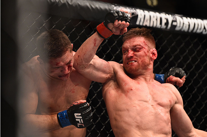 LAS VEGAS, NV - JANUARY 02: (R-L) Scott Holtzman elbows Drew Dober in their lightweight bout during the UFC 195 event inside MGM Grand Garden Arena on January 2, 2016 in Las Vegas, Nevada. (Photo by Jeff Bottari/Zuffa LLC/Zuffa LLC via Getty Images)