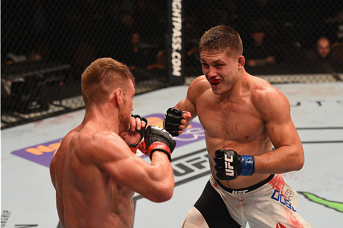LAS VEGAS, NV - JANUARY 02: (R-L) Drew Dober punches Scott Holtzman in their lightweight bout during the UFC 195 event inside MGM Grand Garden Arena on January 2, 2016 in Las Vegas, Nevada. (Photo by Josh Hedges/Zuffa LLC/Zuffa LLC via Getty Images)