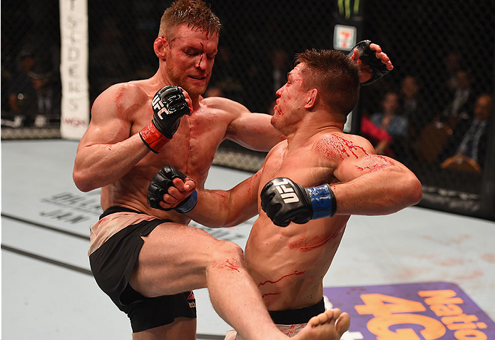 LAS VEGAS, NV - JANUARY 02: (L-R) Scott Holtzman kicks Drew Dober in their lightweight bout during the UFC 195 event inside MGM Grand Garden Arena on January 2, 2016 in Las Vegas, Nevada. (Photo by Josh Hedges/Zuffa LLC/Zuffa LLC via Getty Images)