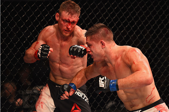 LAS VEGAS, NV - JANUARY 02: (L-R) Scott Holtzman and Drew Dober exchange punches in their lightweight bout during the UFC 195 event inside MGM Grand Garden Arena on January 2, 2016 in Las Vegas, Nevada. (Photo by Josh Hedges/Zuffa LLC/Zuffa LLC via Getty